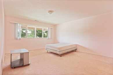 This top floor condo is located next to The Saginaw Country Club on Saginaw Country Club in Michigan - for sale on GolfHomes.com, golf home, golf lot