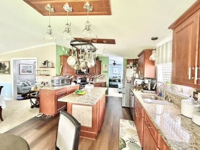 This lovely 3-bedroom, 2-bathroom manufactured home is located on Crane Lakes Golf and Country Club in Florida - for sale on GolfHomes.com, golf home, golf lot