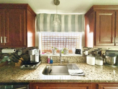 This lovely 3-bedroom, 2-bathroom manufactured home is located on Crane Lakes Golf and Country Club in Florida - for sale on GolfHomes.com, golf home, golf lot