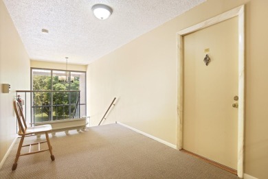 This top floor condo is located next to The Saginaw Country Club on Saginaw Country Club in Michigan - for sale on GolfHomes.com, golf home, golf lot