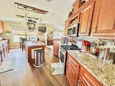 This lovely 3-bedroom, 2-bathroom manufactured home is located on Crane Lakes Golf and Country Club in Florida - for sale on GolfHomes.com, golf home, golf lot