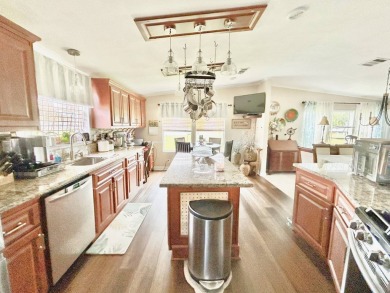 This lovely 3-bedroom, 2-bathroom manufactured home is located on Crane Lakes Golf and Country Club in Florida - for sale on GolfHomes.com, golf home, golf lot