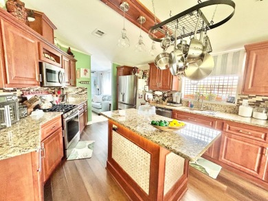 This lovely 3-bedroom, 2-bathroom manufactured home is located on Crane Lakes Golf and Country Club in Florida - for sale on GolfHomes.com, golf home, golf lot