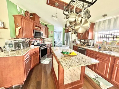 This lovely 3-bedroom, 2-bathroom manufactured home is located on Crane Lakes Golf and Country Club in Florida - for sale on GolfHomes.com, golf home, golf lot