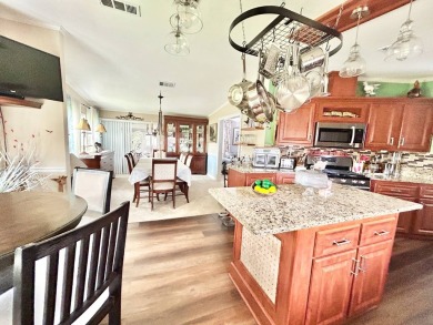 This lovely 3-bedroom, 2-bathroom manufactured home is located on Crane Lakes Golf and Country Club in Florida - for sale on GolfHomes.com, golf home, golf lot