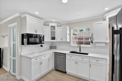 Smart-technology? Yes! Modern conveniences? Yes! Solid brick on Diamondhead Country Club in Mississippi - for sale on GolfHomes.com, golf home, golf lot