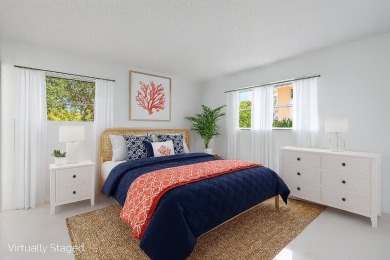 Embrace easy living in this sunlit 2BR/2BA end-unit condo in on The Little Club in Florida - for sale on GolfHomes.com, golf home, golf lot