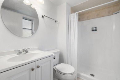 Embrace easy living in this sunlit 2BR/2BA end-unit condo in on The Little Club in Florida - for sale on GolfHomes.com, golf home, golf lot