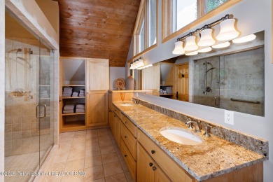 Bordering the 11th fairway of the prestigious Teton Pines golf on Teton Pines Golf Club in Wyoming - for sale on GolfHomes.com, golf home, golf lot