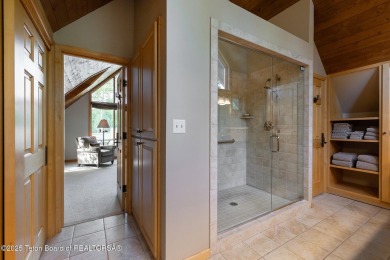Bordering the 11th fairway of the prestigious Teton Pines golf on Teton Pines Golf Club in Wyoming - for sale on GolfHomes.com, golf home, golf lot