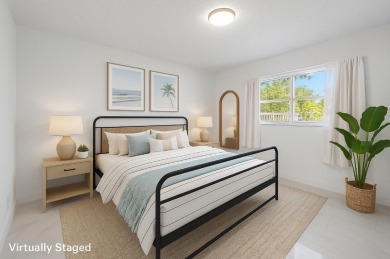 Embrace easy living in this sunlit 2BR/2BA end-unit condo in on The Little Club in Florida - for sale on GolfHomes.com, golf home, golf lot