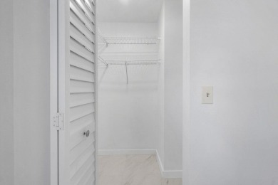 Embrace easy living in this sunlit 2BR/2BA end-unit condo in on The Little Club in Florida - for sale on GolfHomes.com, golf home, golf lot