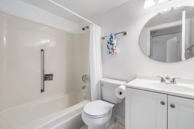 Embrace easy living in this sunlit 2BR/2BA end-unit condo in on The Little Club in Florida - for sale on GolfHomes.com, golf home, golf lot