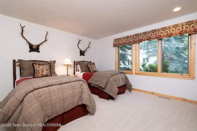 Bordering the 11th fairway of the prestigious Teton Pines golf on Teton Pines Golf Club in Wyoming - for sale on GolfHomes.com, golf home, golf lot