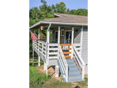 Welcome to this charming remodeled cottage style home featuring on Holiday Island Executive Golf Course in Arkansas - for sale on GolfHomes.com, golf home, golf lot