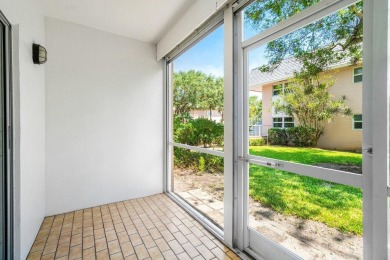Embrace easy living in this sunlit 2BR/2BA end-unit condo in on The Little Club in Florida - for sale on GolfHomes.com, golf home, golf lot