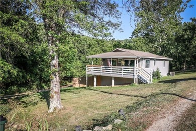 Welcome to this charming remodeled cottage style home featuring on Holiday Island Executive Golf Course in Arkansas - for sale on GolfHomes.com, golf home, golf lot
