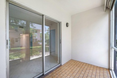 Embrace easy living in this sunlit 2BR/2BA end-unit condo in on The Little Club in Florida - for sale on GolfHomes.com, golf home, golf lot