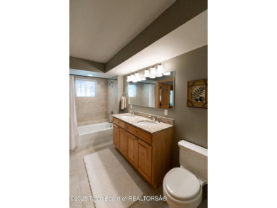 Bordering the 11th fairway of the prestigious Teton Pines golf on Teton Pines Golf Club in Wyoming - for sale on GolfHomes.com, golf home, golf lot