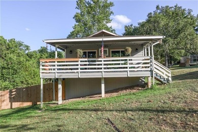 Welcome to this charming remodeled cottage style home featuring on Holiday Island Executive Golf Course in Arkansas - for sale on GolfHomes.com, golf home, golf lot