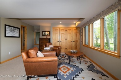 Bordering the 11th fairway of the prestigious Teton Pines golf on Teton Pines Golf Club in Wyoming - for sale on GolfHomes.com, golf home, golf lot