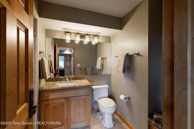 Bordering the 11th fairway of the prestigious Teton Pines golf on Teton Pines Golf Club in Wyoming - for sale on GolfHomes.com, golf home, golf lot