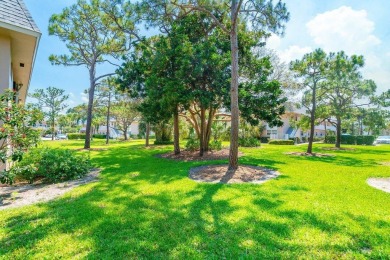 Embrace easy living in this sunlit 2BR/2BA end-unit condo in on The Little Club in Florida - for sale on GolfHomes.com, golf home, golf lot
