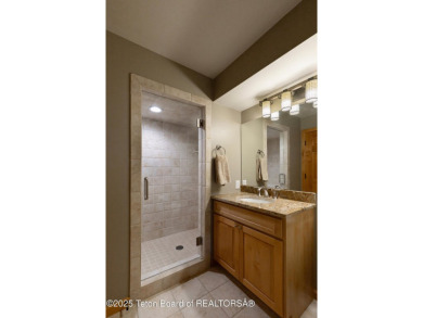 Bordering the 11th fairway of the prestigious Teton Pines golf on Teton Pines Golf Club in Wyoming - for sale on GolfHomes.com, golf home, golf lot