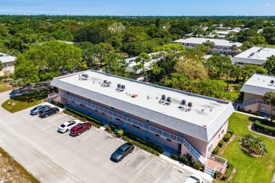 Embrace easy living in this sunlit 2BR/2BA end-unit condo in on The Little Club in Florida - for sale on GolfHomes.com, golf home, golf lot