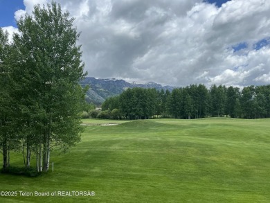 Bordering the 11th fairway of the prestigious Teton Pines golf on Teton Pines Golf Club in Wyoming - for sale on GolfHomes.com, golf home, golf lot