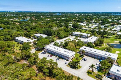 Embrace easy living in this sunlit 2BR/2BA end-unit condo in on The Little Club in Florida - for sale on GolfHomes.com, golf home, golf lot