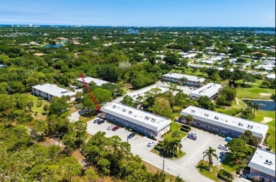 Embrace easy living in this sunlit 2BR/2BA end-unit condo in on The Little Club in Florida - for sale on GolfHomes.com, golf home, golf lot