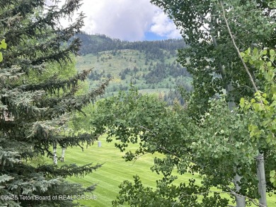 Bordering the 11th fairway of the prestigious Teton Pines golf on Teton Pines Golf Club in Wyoming - for sale on GolfHomes.com, golf home, golf lot