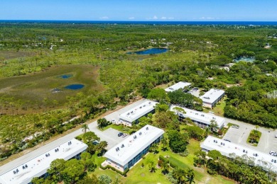 Embrace easy living in this sunlit 2BR/2BA end-unit condo in on The Little Club in Florida - for sale on GolfHomes.com, golf home, golf lot