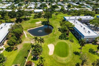 Embrace easy living in this sunlit 2BR/2BA end-unit condo in on The Little Club in Florida - for sale on GolfHomes.com, golf home, golf lot