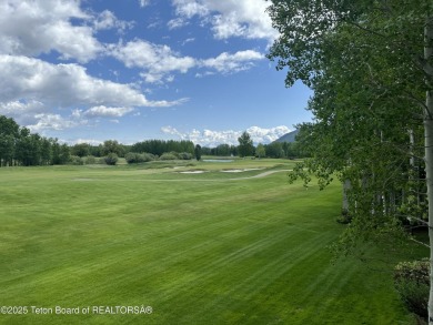 Bordering the 11th fairway of the prestigious Teton Pines golf on Teton Pines Golf Club in Wyoming - for sale on GolfHomes.com, golf home, golf lot