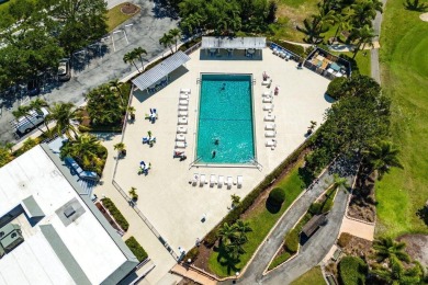 Embrace easy living in this sunlit 2BR/2BA end-unit condo in on The Little Club in Florida - for sale on GolfHomes.com, golf home, golf lot