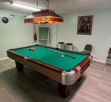 Embrace easy living in this sunlit 2BR/2BA end-unit condo in on The Little Club in Florida - for sale on GolfHomes.com, golf home, golf lot