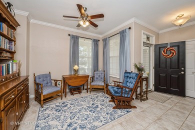 An INVITING front porch and PEACEFUL water feature greets you at on Whisper Creek Golf Club in Illinois - for sale on GolfHomes.com, golf home, golf lot