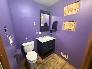 Investor or project-ready opportunity! This ranch with walkout on Hankerd Hills Golf Course in Michigan - for sale on GolfHomes.com, golf home, golf lot