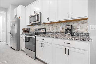 Experience elevated Southwest Florida living in this beautifully on Royal Tee Country Club in Florida - for sale on GolfHomes.com, golf home, golf lot