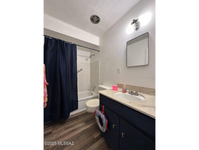 This 2-bedroom, 1-bath upstairs unit in a central Tucson coop on Randolph Park Golf Courses in Arizona - for sale on GolfHomes.com, golf home, golf lot