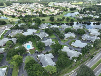 **CLICK ON VIRTUAL TOUR ABOVE** Maintenance FREE Living in the on The Golf Club of Cypress Creek in Florida - for sale on GolfHomes.com, golf home, golf lot