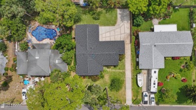 Located in an established neighborhood near the New Smyrna Beach on New Smyrna Beach Golf Course in Florida - for sale on GolfHomes.com, golf home, golf lot