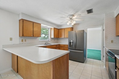 Located in an established neighborhood near the New Smyrna Beach on New Smyrna Beach Golf Course in Florida - for sale on GolfHomes.com, golf home, golf lot