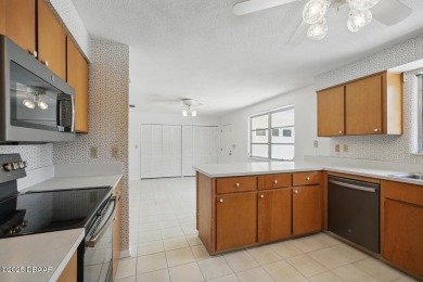 Located in an established neighborhood near the New Smyrna Beach on New Smyrna Beach Golf Course in Florida - for sale on GolfHomes.com, golf home, golf lot