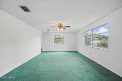 Located in an established neighborhood near the New Smyrna Beach on New Smyrna Beach Golf Course in Florida - for sale on GolfHomes.com, golf home, golf lot