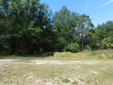 BEAUTIFUL WOODED BUILDING SITE!  This property is just over a on The Ridge Manor Oaks Golf and Country Club in Florida - for sale on GolfHomes.com, golf home, golf lot