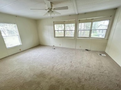 Spacious 2-bed, 2-bath home located just steps from the pool and on Fairways Country Club in Florida - for sale on GolfHomes.com, golf home, golf lot