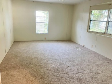 Spacious 2-bed, 2-bath home located just steps from the pool and on Fairways Country Club in Florida - for sale on GolfHomes.com, golf home, golf lot
